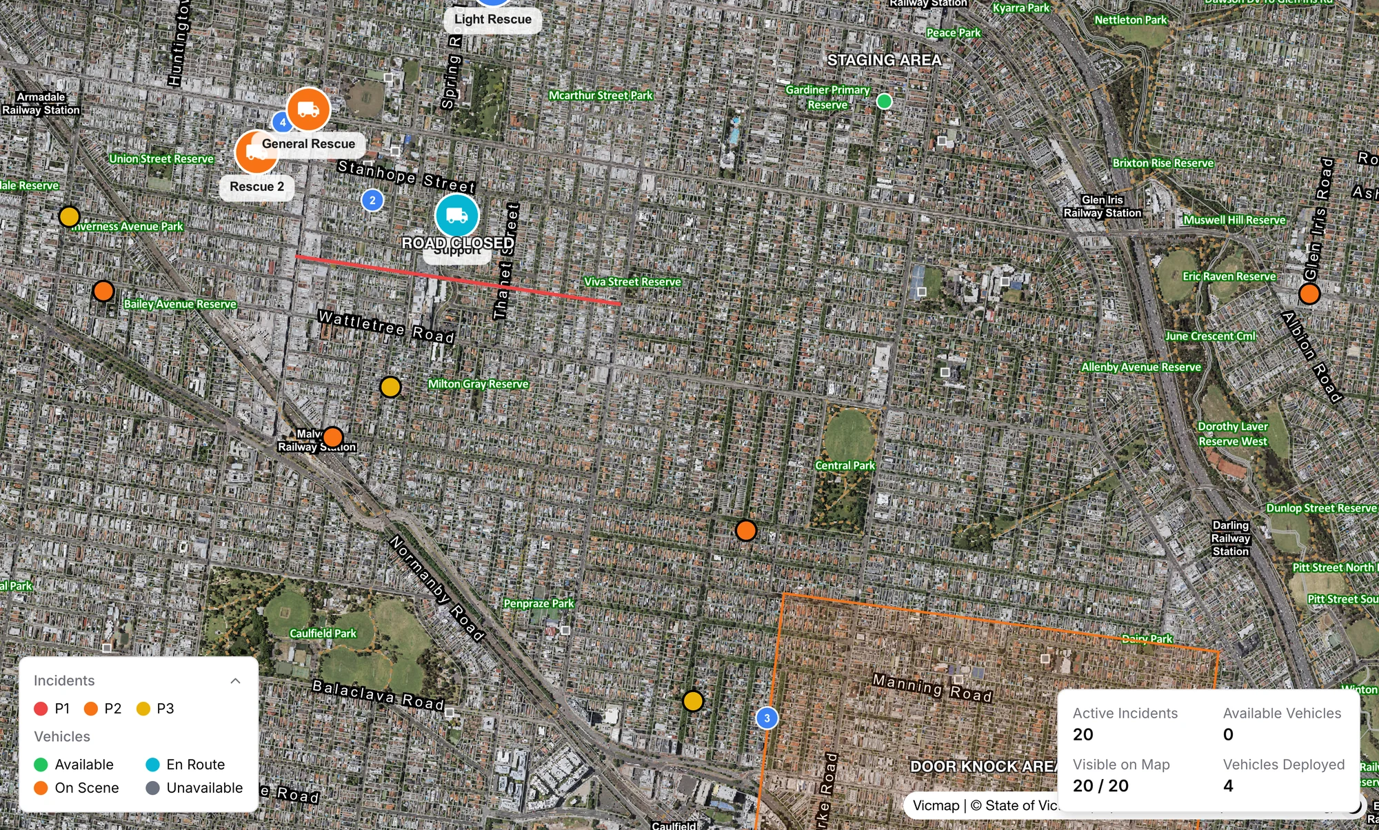 The operations map on aerial photography with vehicles, incidents, a closed road, a staging area and a door knock area drawn on it